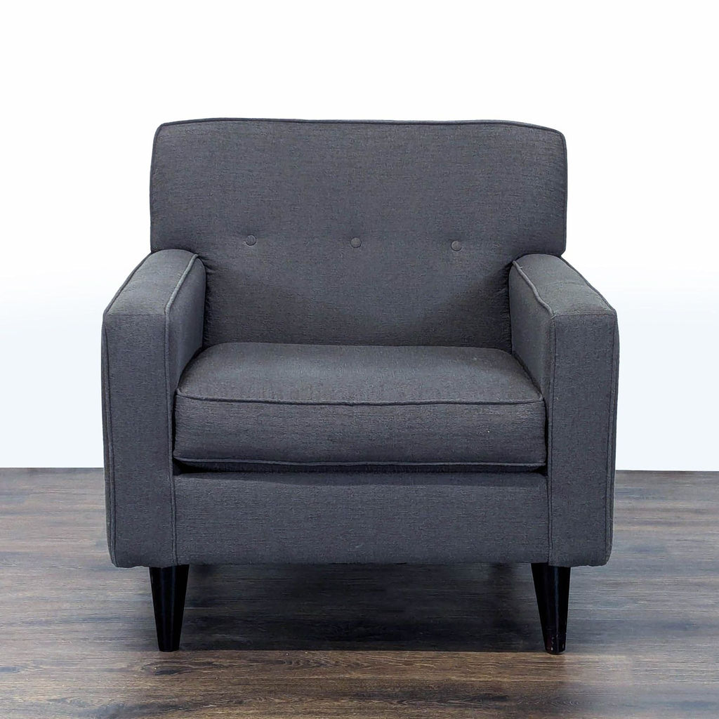 1. Front view of a Max Home lounge chair in dark gray fabric with button-tufted backrest and tapered legs.  