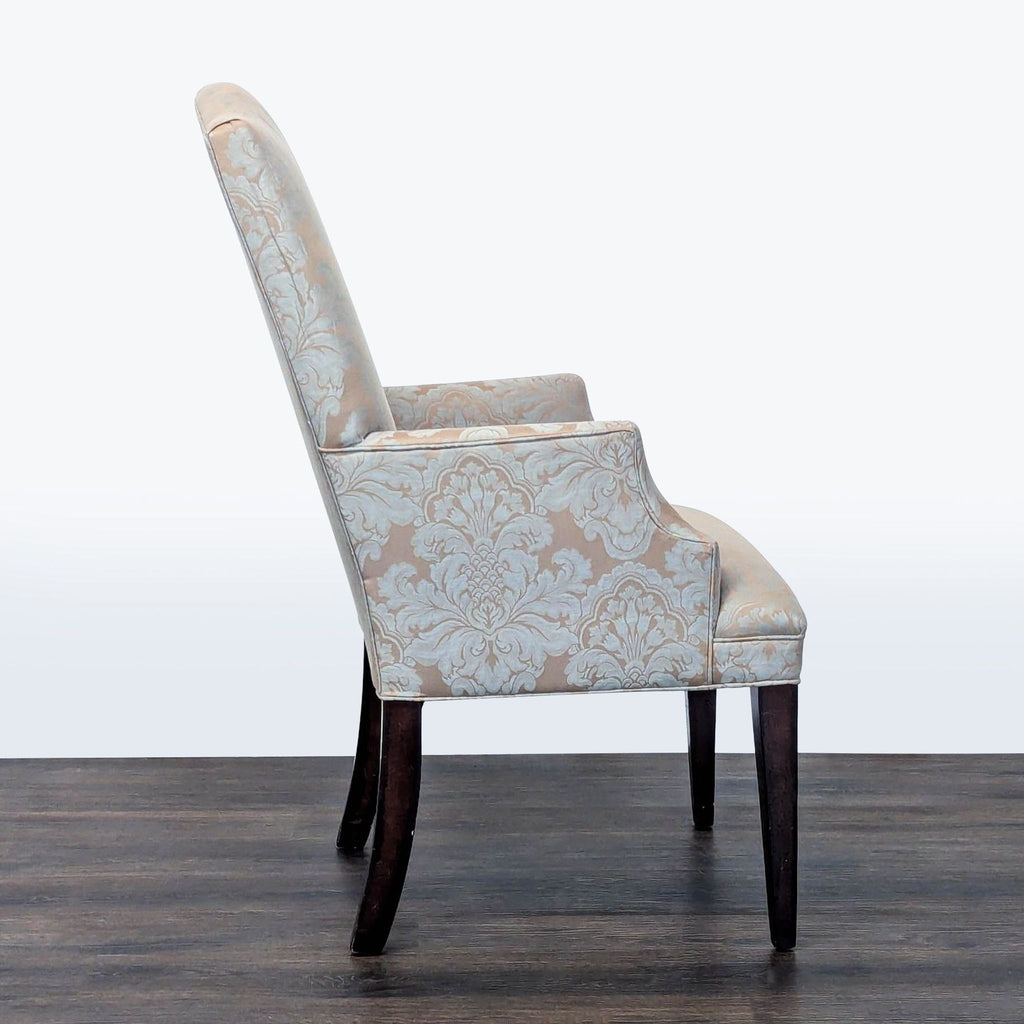 3. Profile view of Mitchell Gold + Bob Williams armchair, featuring ornate fabric and tall backrest.