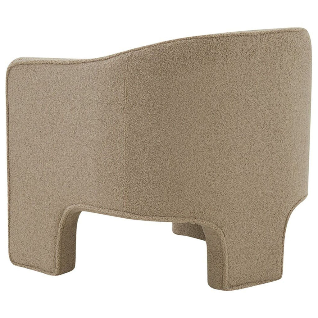 Rear angle of a Safavieh lounge chair in beige fabric, showing its simple curved back and sturdy lounge shape.