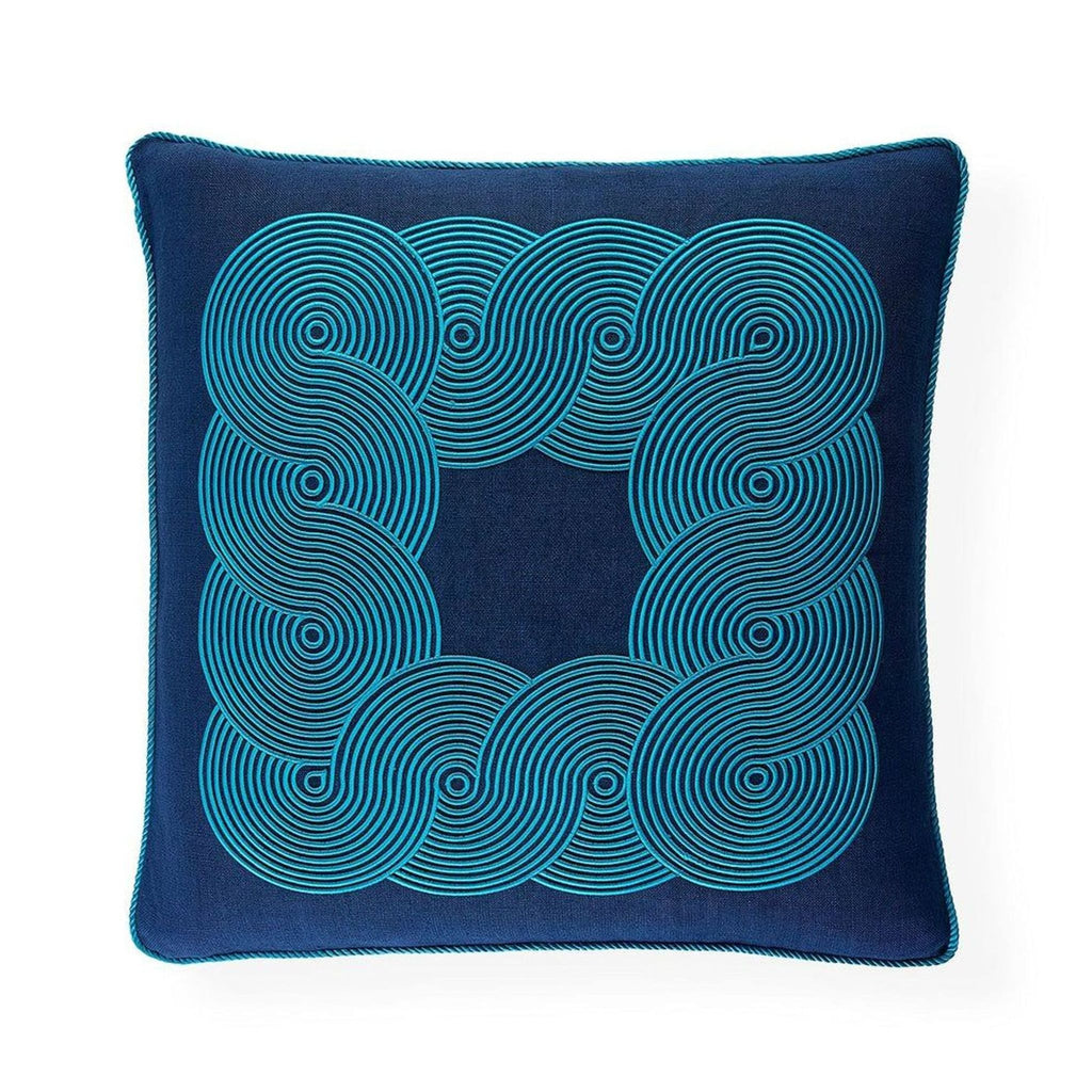 Front view: Square navy linen pillow by Jonathan Adler, with raised blue satin stitch pattern and corded edge.  