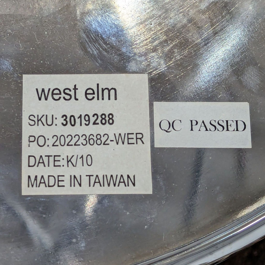 3. Manufacturer label on a West Elm side table with SKU 3019288 and QC Passed sticker, made in Taiwan.
