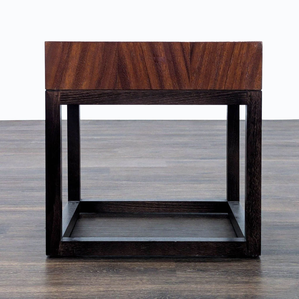 1. Crate & Barrel end table with a thick wood top and open cube-style dark wood frame, shown on wood flooring.