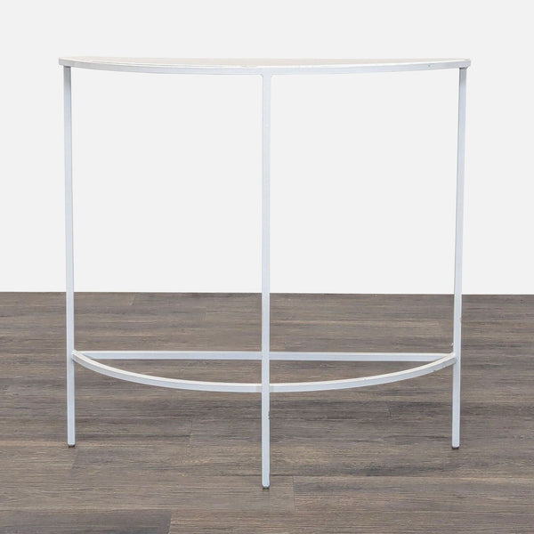 1. Reperch half-moon side table with slim white metal frame and minimalist design on a wooden floor.  