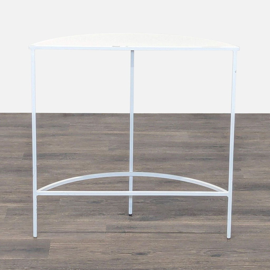 2. Modern Reperch console table in semicircle shape, white frame, shown from a front angle over wood flooring.  