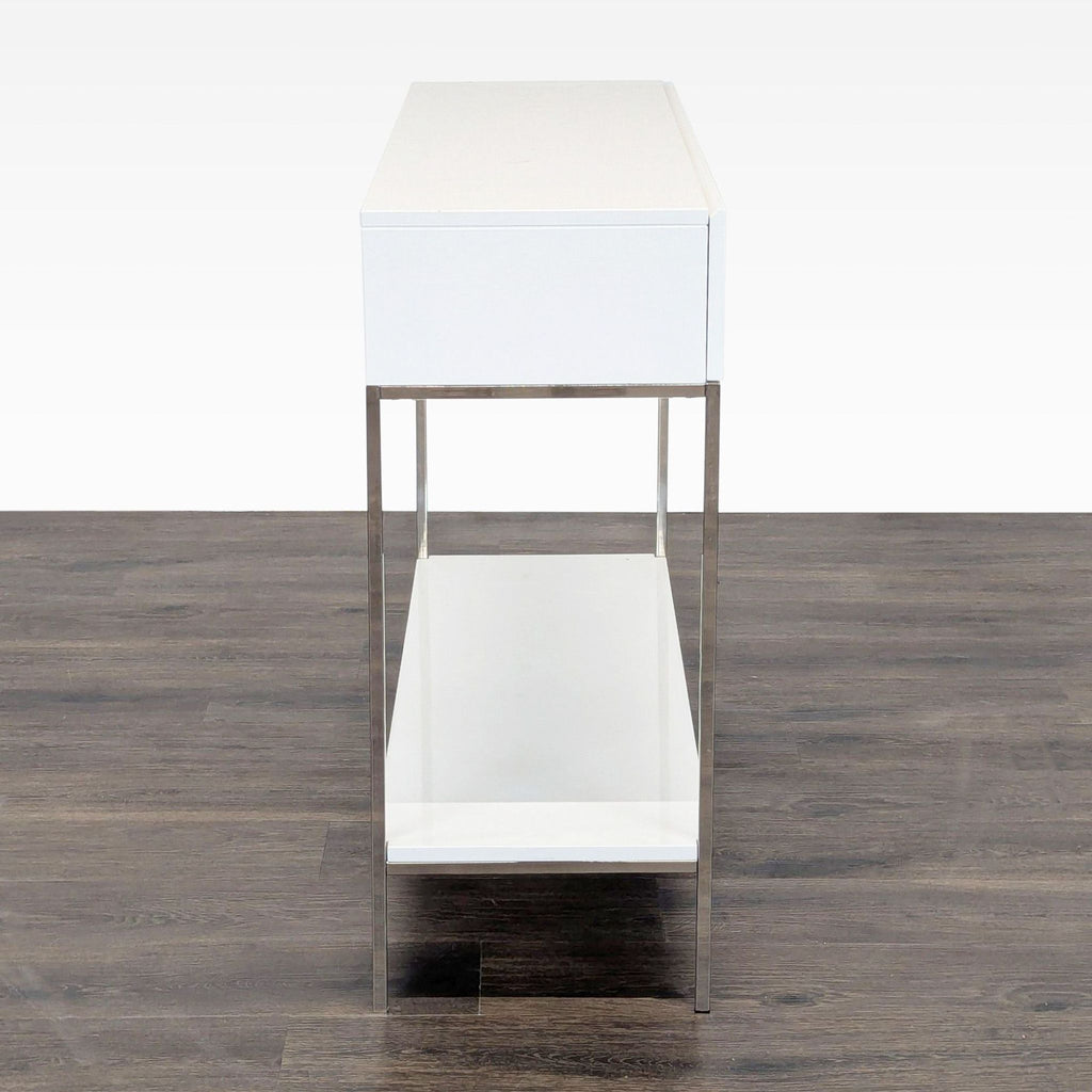 3. Side profile of Reperch Metal Frame side and console table, white with chrome metal legs and lower shelving.