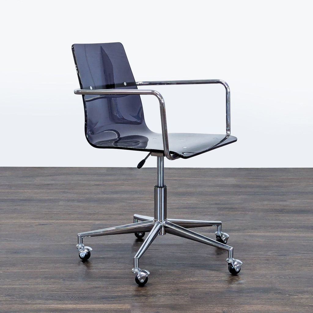 2. Modern Reperch chair in black clear plastic with chrome arms and wheeled base, angled side-front view.