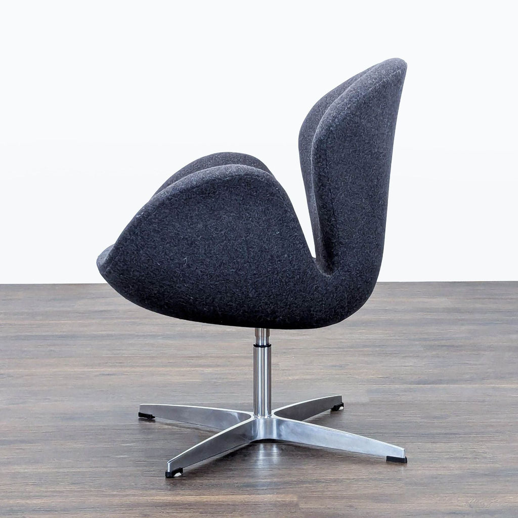 3. Profile view of a Reperch lounge chair highlighting its sculpted back and compact, star-shaped metal base.