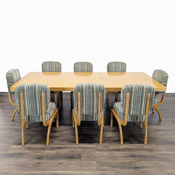 Eight sculptural striped chairs with bentwood frames surround a rectangular Italian modern dining table with expansion leaf.  
