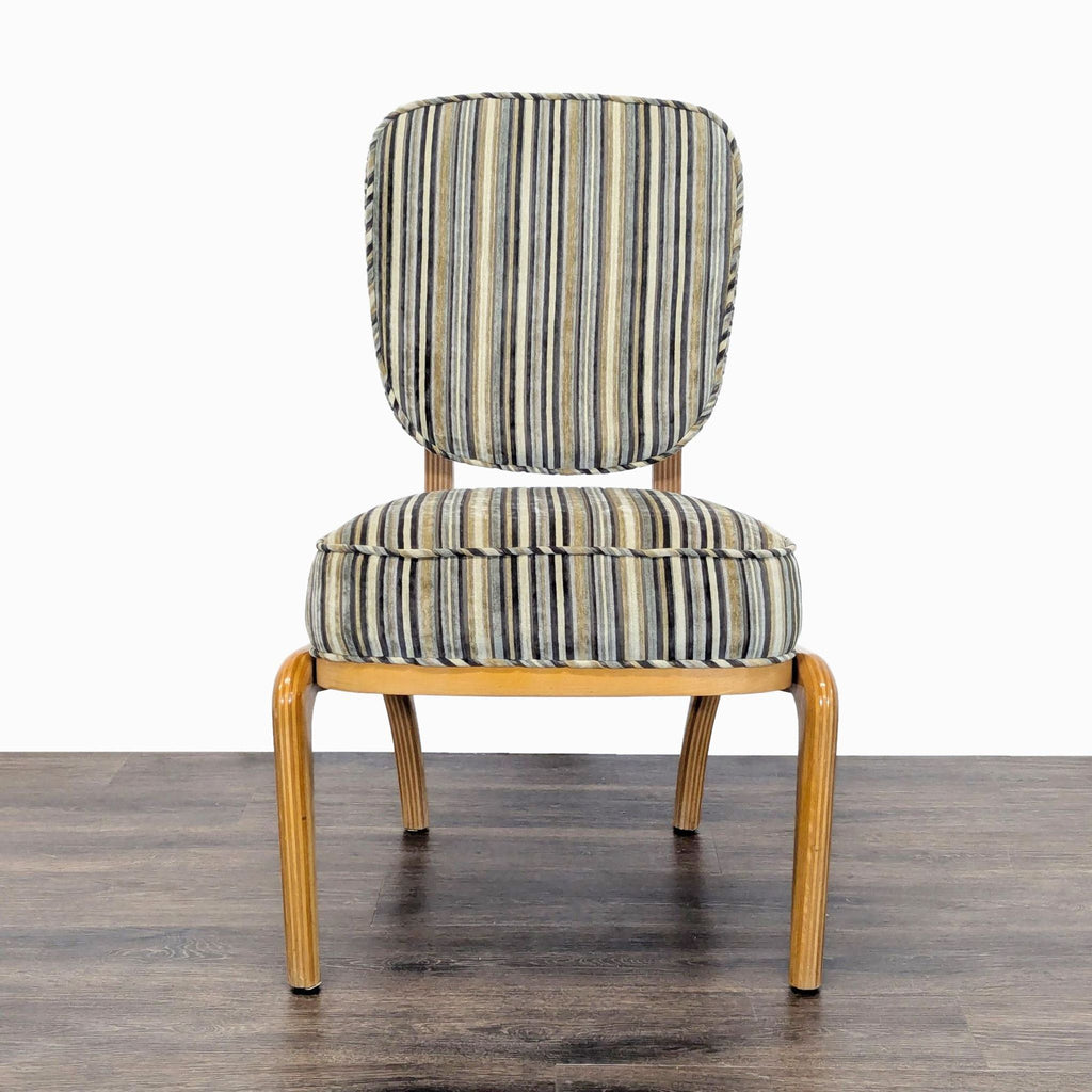 Upholstered dining chair with striped fabric and rounded wood legs, from Reperch dining set.