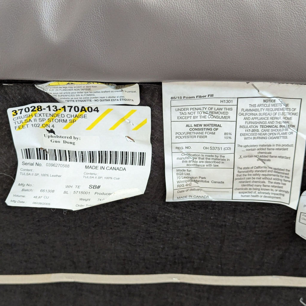 3. Multiple product and material information labels attached to the underside of an EQ3 furniture piece.