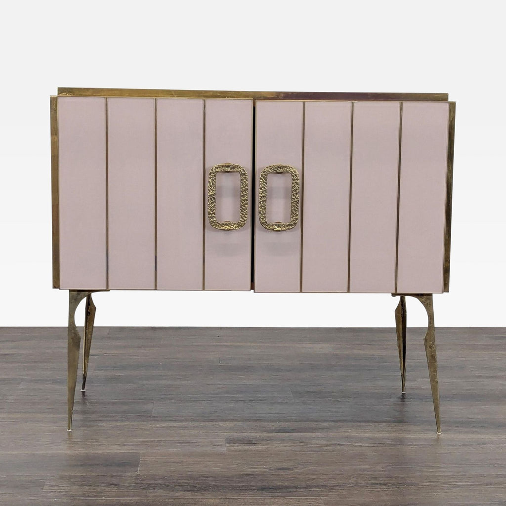 Front view of a handmade 1980s Reperch sideboard with pink Murano glass, gilt brass borders, and handles.  