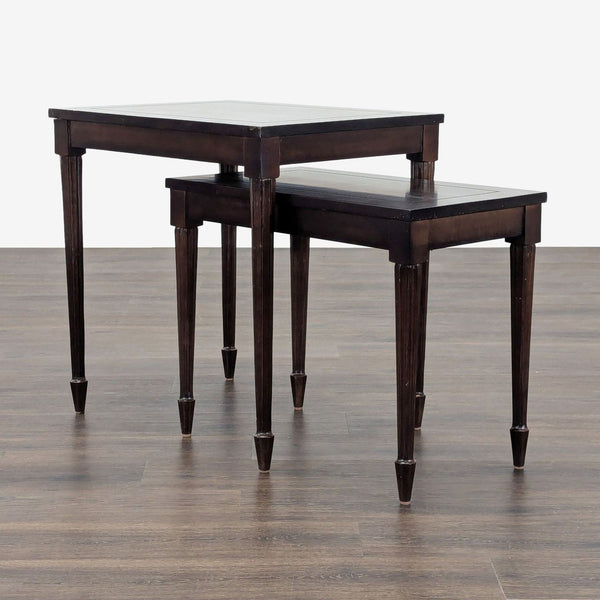 1. Set of two dark wood Reperch side tables, nesting style, with tapered legs on wood flooring.