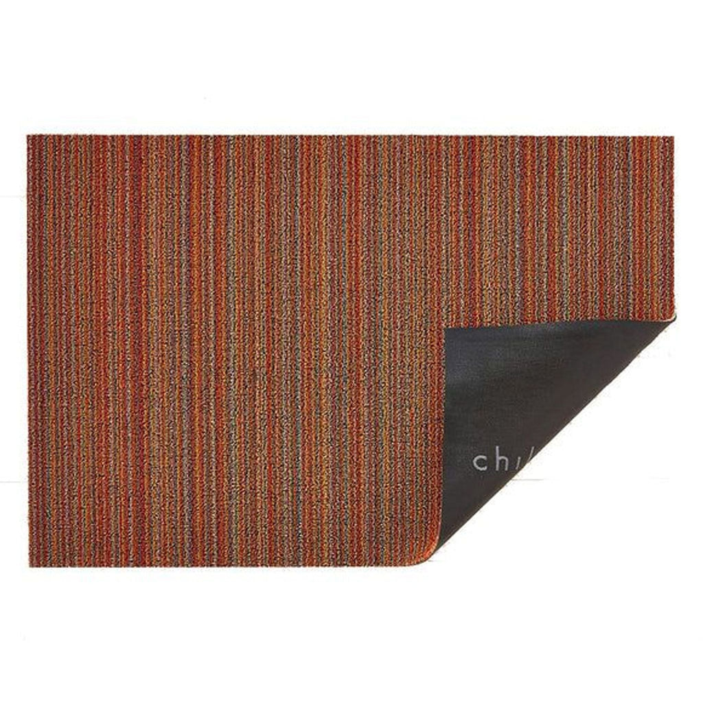 1. Rectangular 2Modern rug with multicolored vertical stripes and one corner flipped to reveal a black backing.