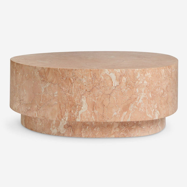 1. Modern Lulu and Georgia Faas coffee table with a rounded, clean silhouette and lightly polished peach marble top.  