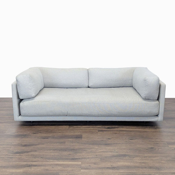 1. BluDot 3-seat sofa in light grey fabric with plush cushions, modern design, and sturdy build, ideal for living rooms.