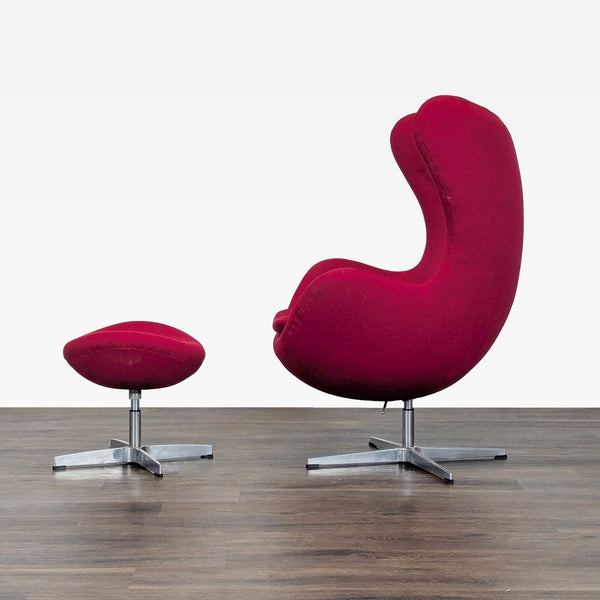 Modern red Reperch lounge chair and matching ottoman on metal bases, shown on a wooden floor.  