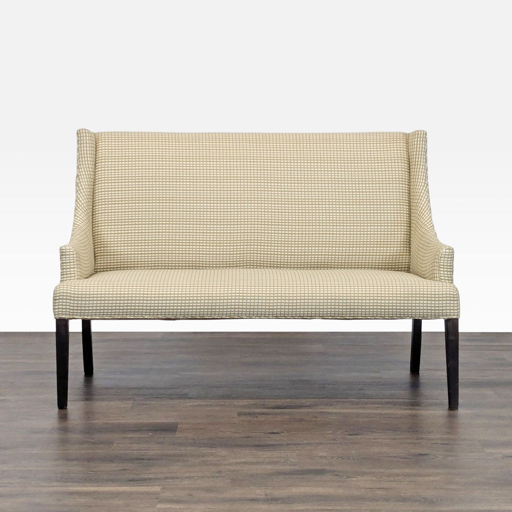 1. A beige patterned bench with high back and wooden legs, from Reperch, shown against a wood floor.