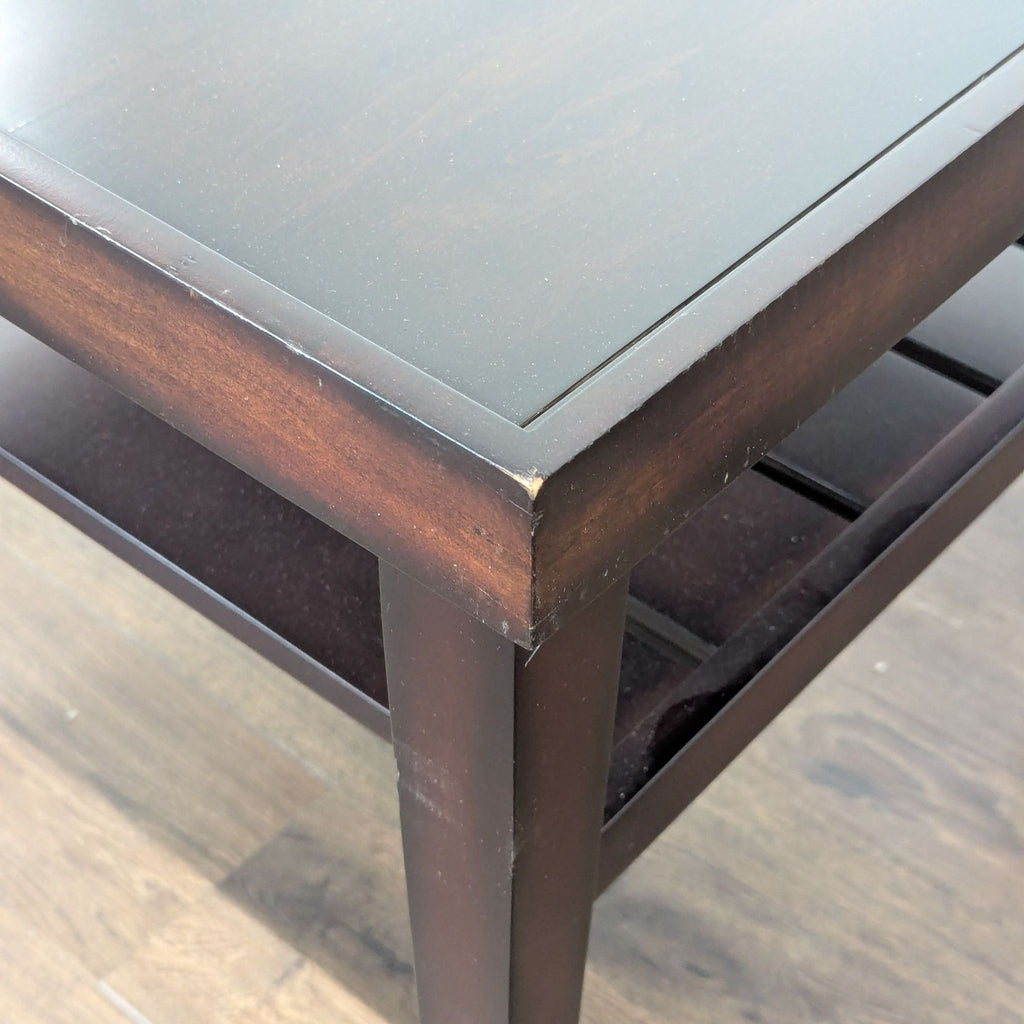 2. Close-up of the Reperch end table corner showing dark wood finish and minor edge wear detail.