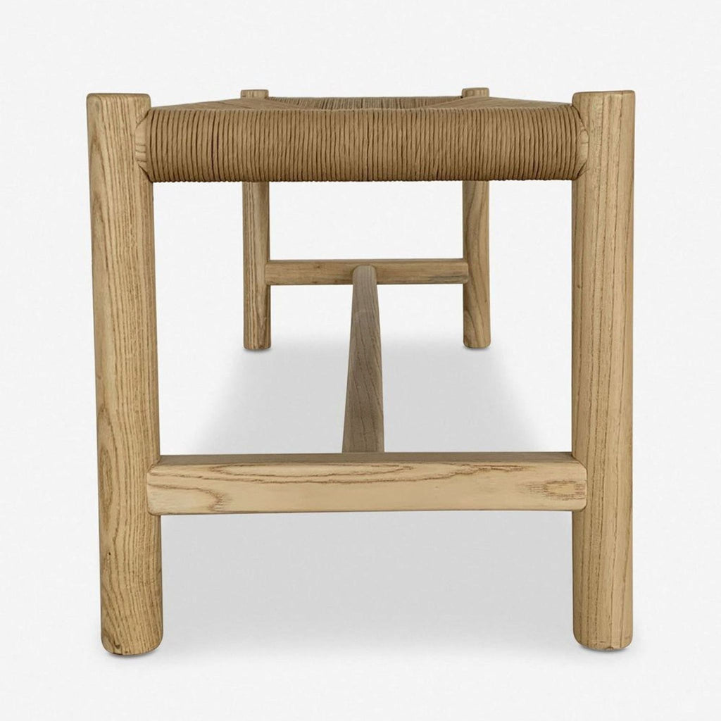 3. End view of a Lulu and Georgia bench featuring a woven rope seat and simple wood construction.