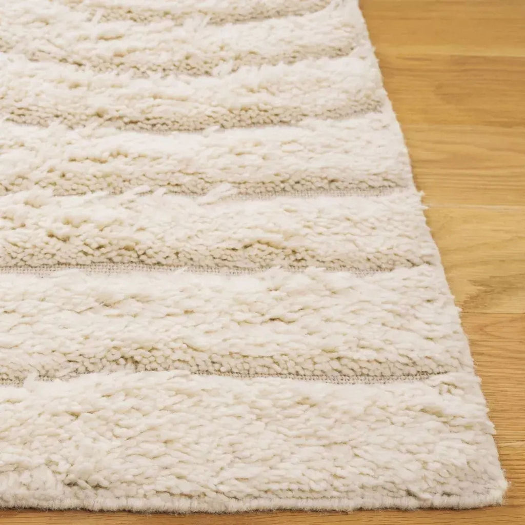 2. Close-up of the Havenly rug's plush pile, highlighting its soft, cream-colored texture and subtle stripe design.