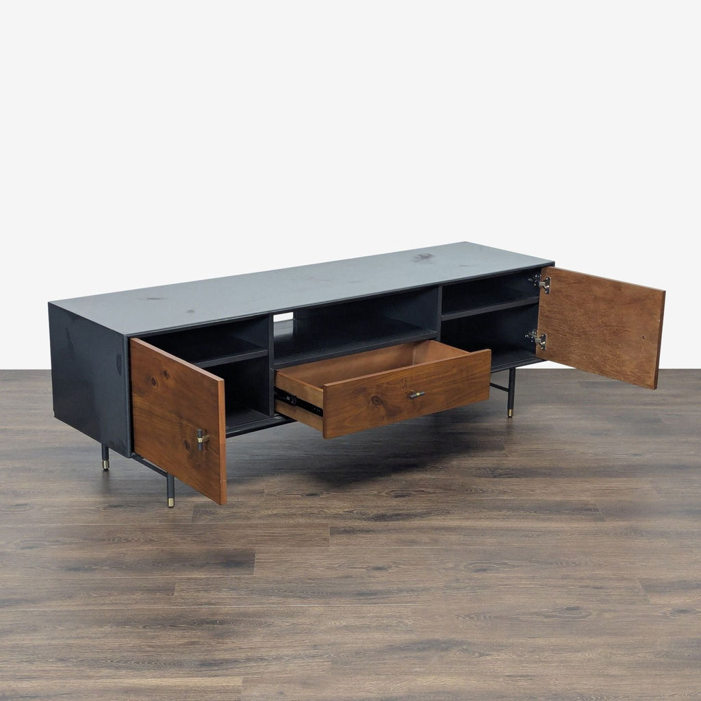 2. West Elm media console in walnut veneer, showing open storage compartments and drawer, on a wood floor.