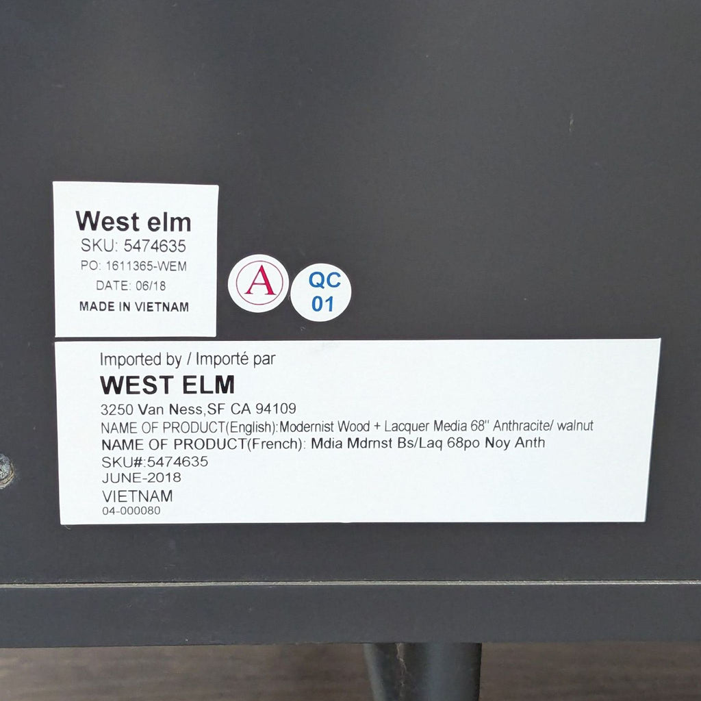 3. West Elm product label detailing SKU, origin, and product info for a walnut and lacquer entertainment center.