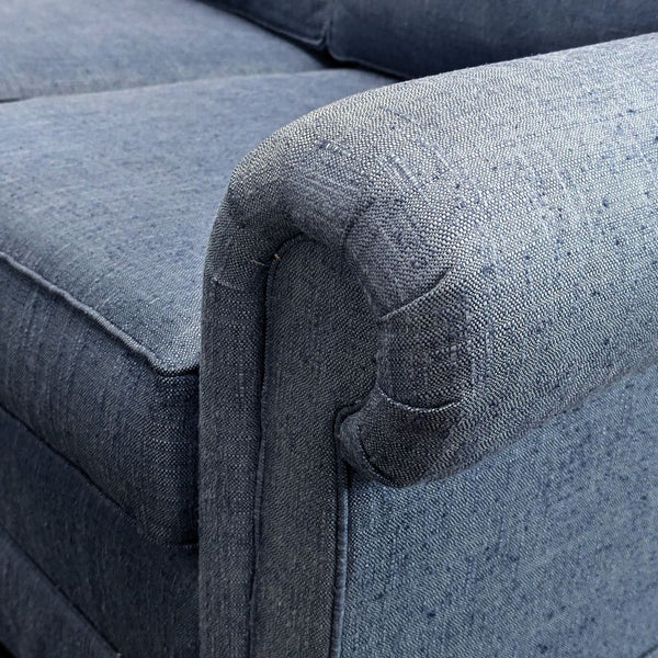 Close-up of a Sherrill 3-seat sofa arm, upholstered in textured blue fabric.  