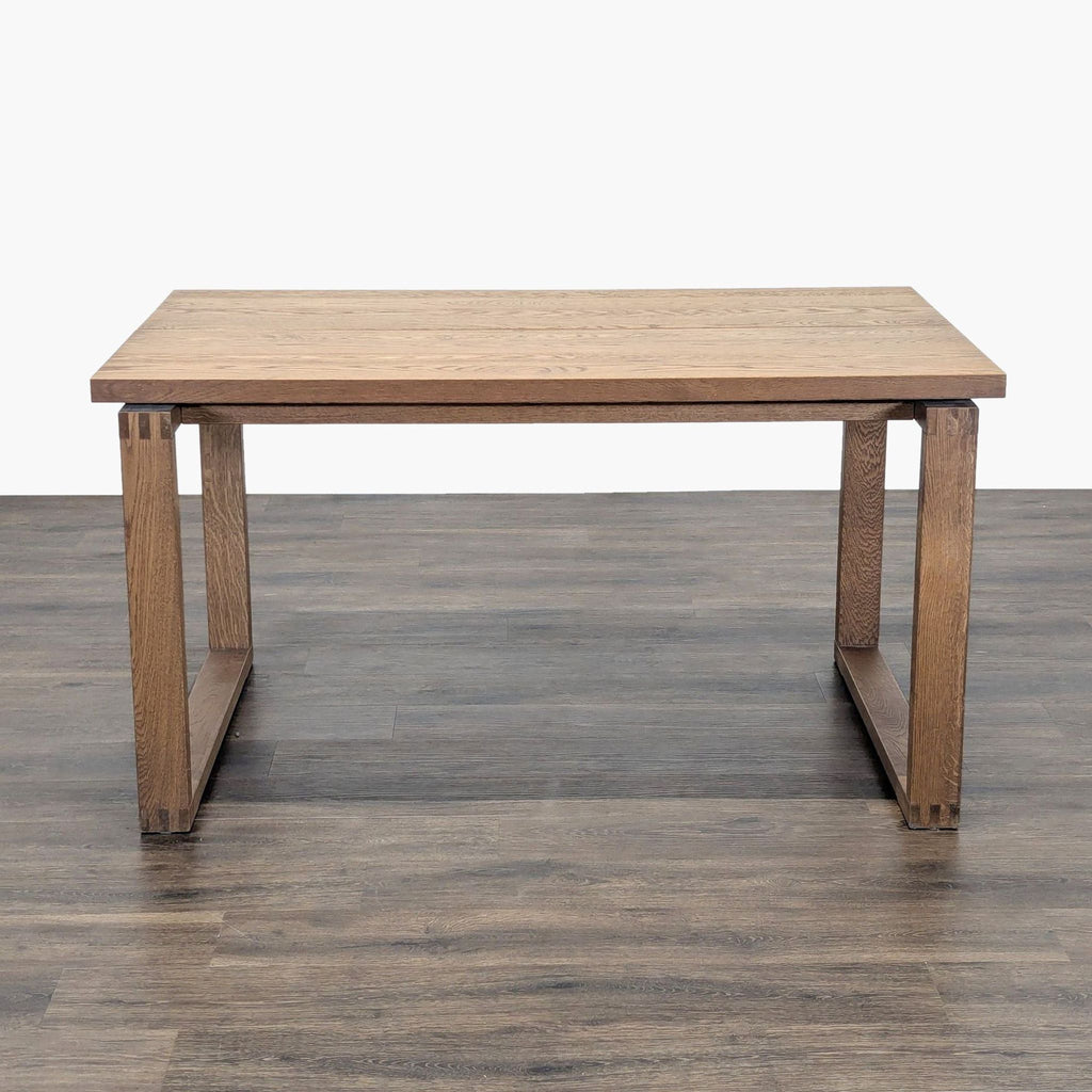 1. IKEA dining table with a plank design in oak veneer, featuring rectangular legs and a minimalist style.