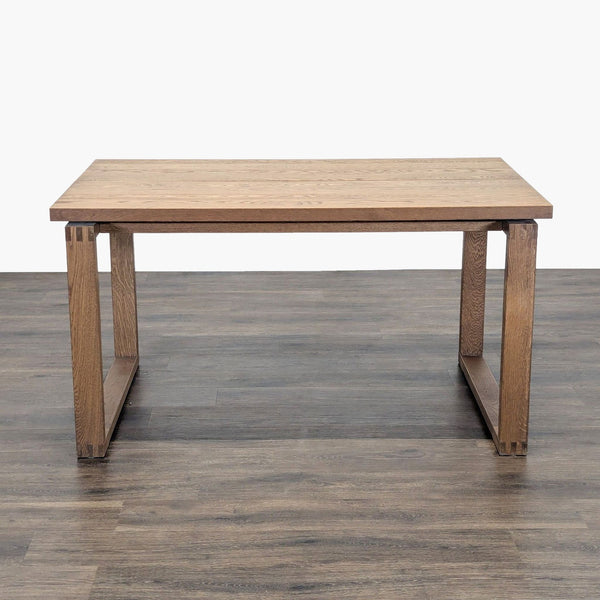 1. IKEA dining table with a plank design in oak veneer, featuring rectangular legs and a minimalist style.
