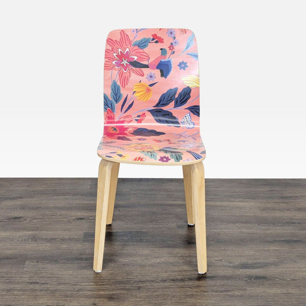1. Front view of an Anthropologie bentwood dining chair with clear lacquer finish and a vibrant floral patterned seat.