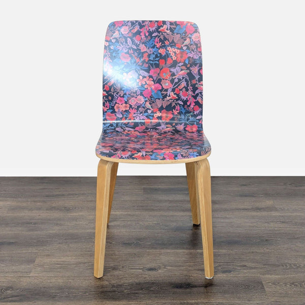 1. Bentwood dining chair by Anthropologie with a clear lacquer finish and colorful floral patterned seat, front view.
