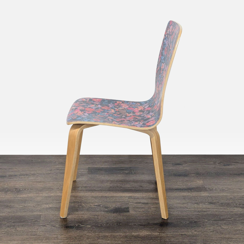 3. Side profile of a patterned seat bentwood dining chair from Anthropologie with a clear lacquer finish.