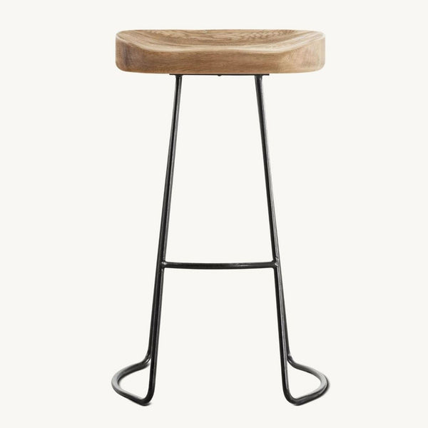 1. Restoration Hardware stool with a sculpted wooden seat and slender black metal frame, seen from the front.