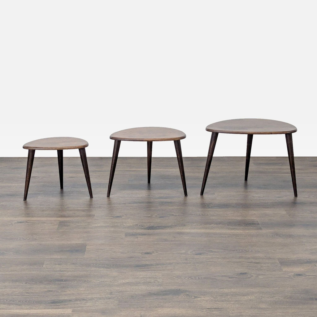 2. Three Reperch side tables in good condition, arranged separately, with dark wooden tops and legs.