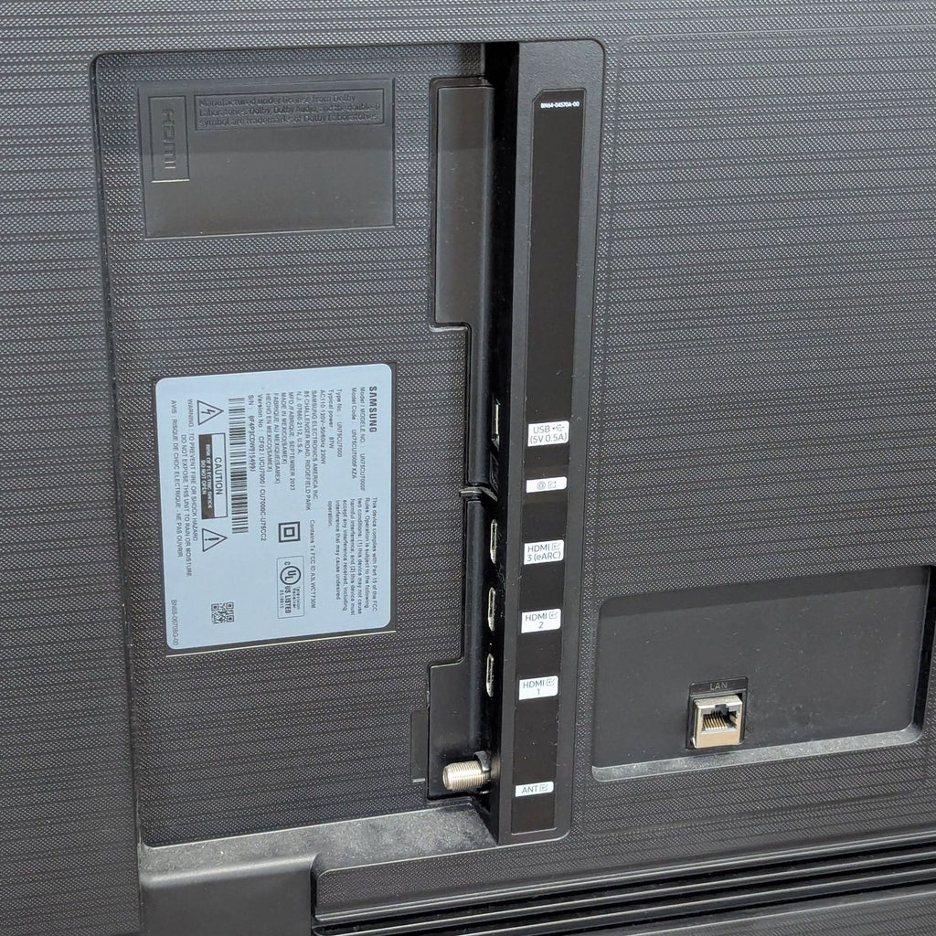 Close-up of Samsung TV input ports, including HDMI, USB, antenna, and LAN connections.  