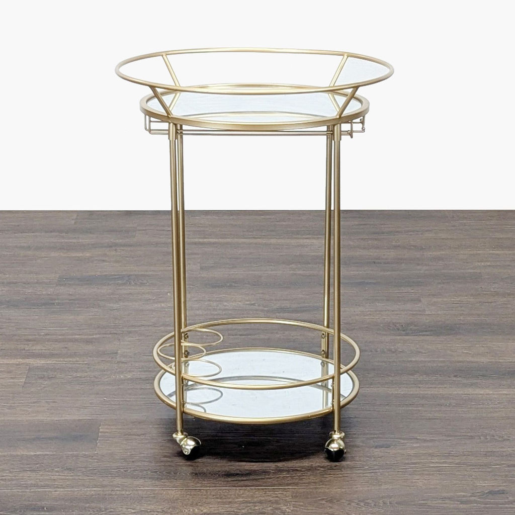 3. Elegant Reperch bar cart in gold finish with two glass tiers and rolling wheels, suitable for modern spaces.
