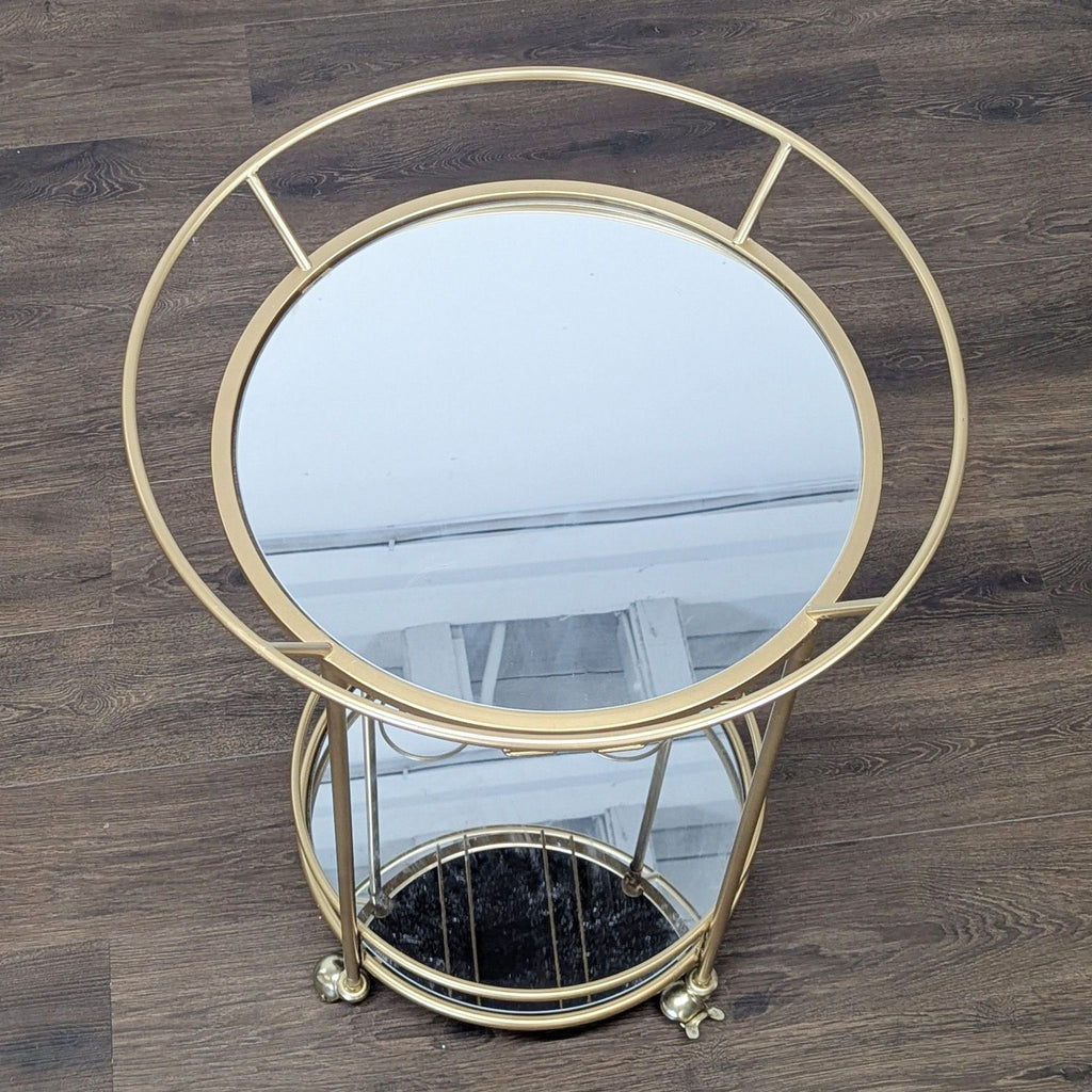 2. Top-down view of Reperch gold bar cart showing circular glass shelves and a modern metal frame design.  