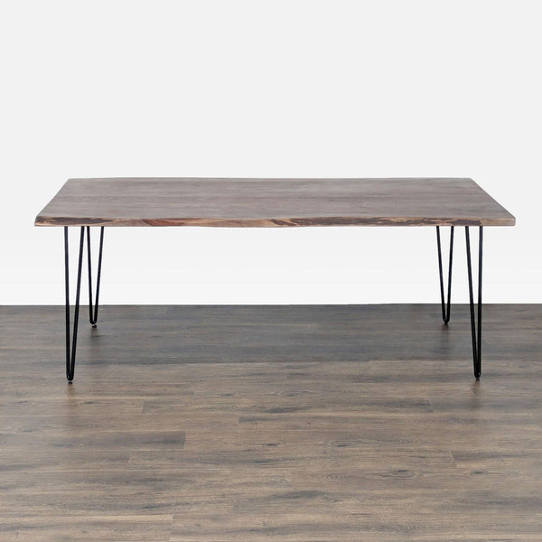 Reperch dining table with metal hairpin legs and a natural wood top, shown in a minimalist setting.
