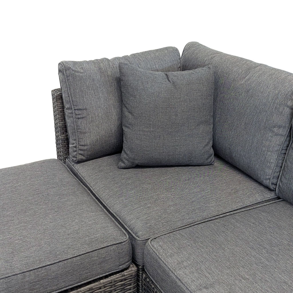 2. Close-up of the corner cushions of a gray Reperch sectional set, showing details of the fabric and padding.