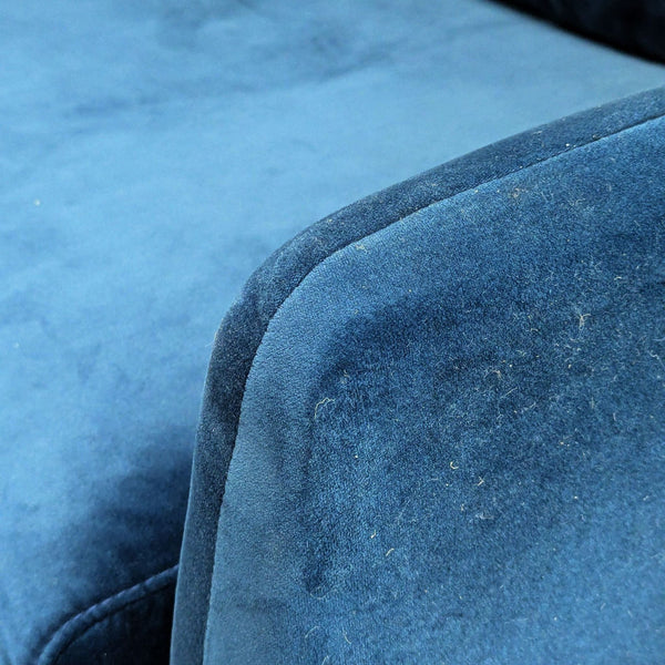 Close-up of soft blue velvet upholstery on an Edloe Finch lounge furniture piece, showing texture detail.