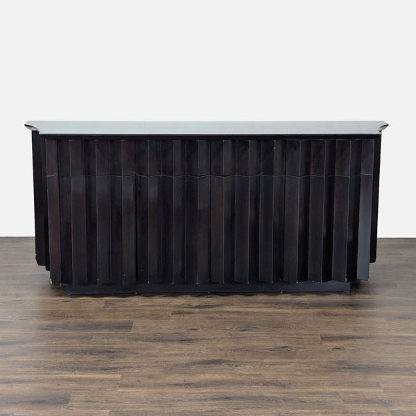 1. Black sideboard by Derepage Design with an origami-inspired folded front, shown against a wood floor.  