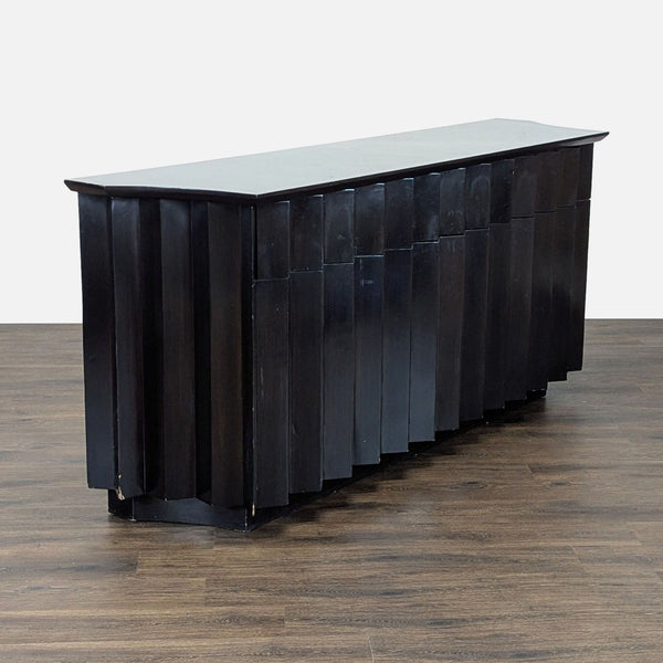 1. Black wooden Derepage Design sideboard with a sculptural front, shown on a dark wood floor.  