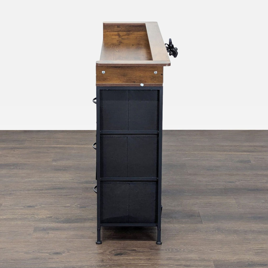 3. Side profile of the Reperch sideboard, highlighting the slim depth and combination of wood and black fabric drawers.