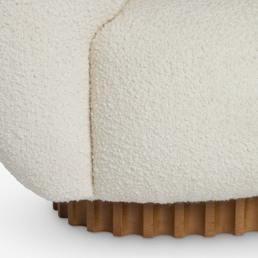 2. Close-up of the Lulu and Georgia sofa’s boucle upholstery and ribbed wooden base highlighting texture details.