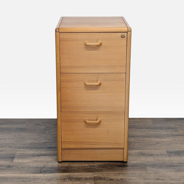 Front view of a Reperch filing cabinet with three drawers, light oak finish, and a lock on the top drawer.