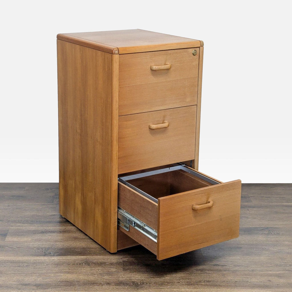 1. Reperch wooden cabinet with three drawers, one open, on a wood floor. Category: Cabinets.  