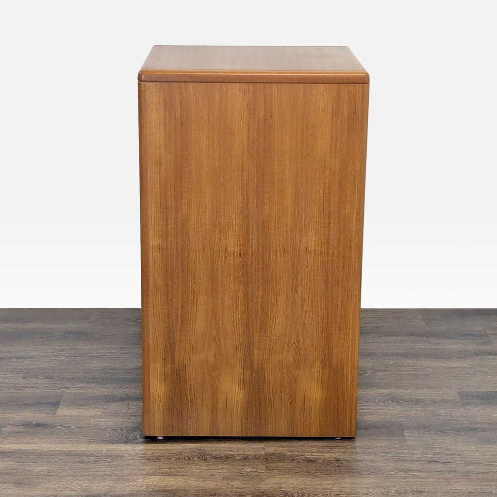 2. Side view of a Reperch wooden cabinet with smooth, flat surface and simple design. Category: Cabinets.  