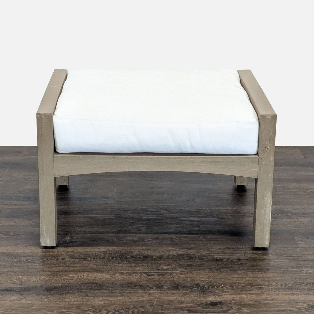 2. Square Pottery Barn stool or ottoman featuring a solid wood frame and plush white cushion.  