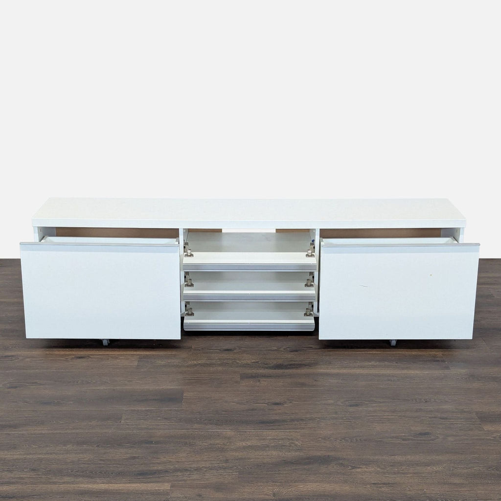 2. Open drawers showing storage space in Reperch entertainment center, including two large and three smaller drawers.