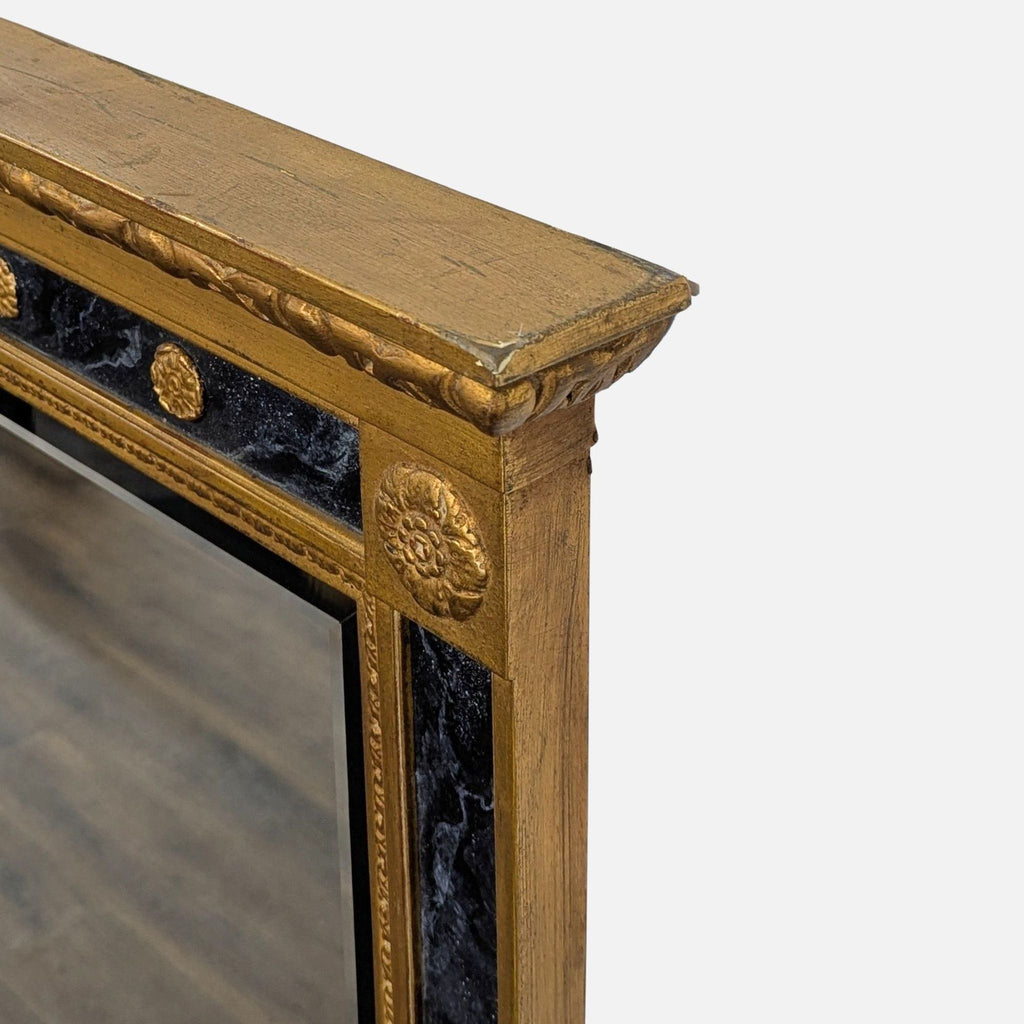 2. Close-up of ornate gold and black marbleized frame detailing on a Neo Classical Carvers' Guild mirror.  